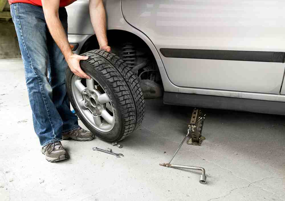 changing a flat tyre for a spare one